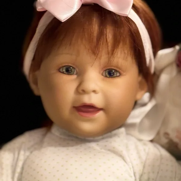 Adorable Baby Doll with Pink Bow - Picture 1 of 9